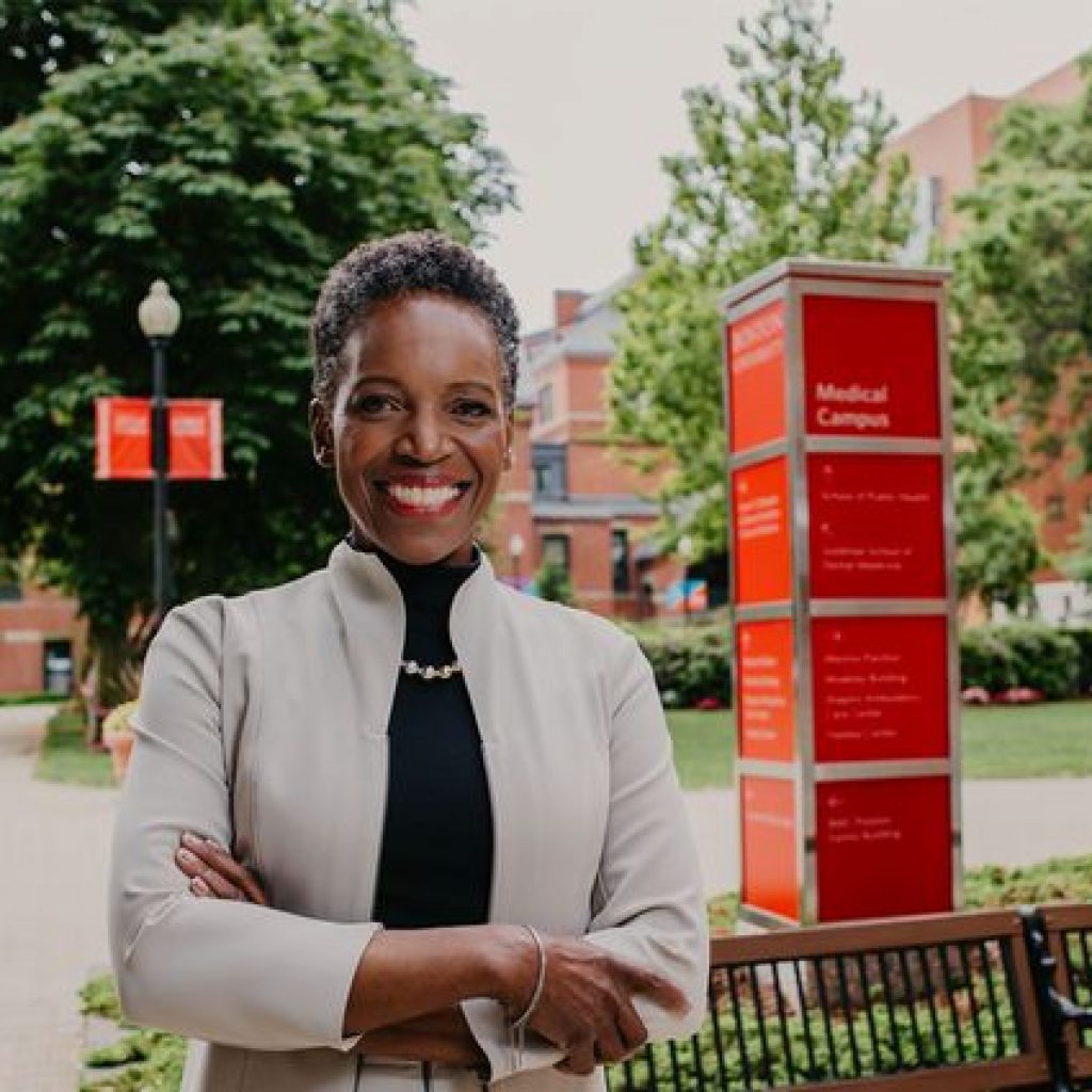 Melissa Gilliam in front of campus sign